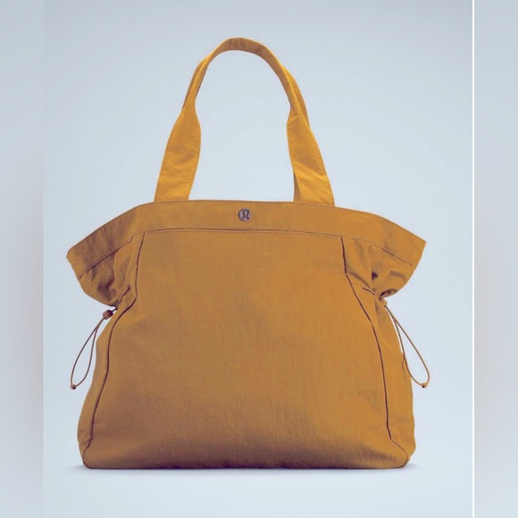 lululemon athletica Handbags - Lululemon Side Cinch Shoppers Tote Bag 18L Color Mustard Color NWT